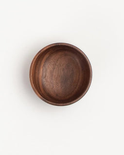 2-inch walnut wood small condiment cup with rich natural grain, on a white background.