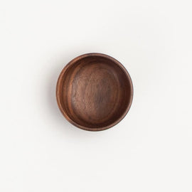 2-inch walnut wood small condiment cup with rich natural grain, on a white background.