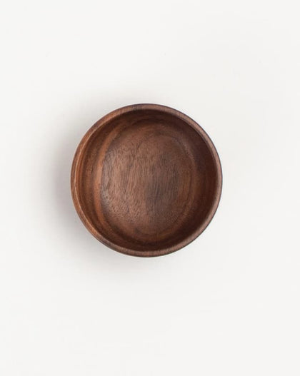 2-inch walnut wood small condiment cup with rich natural grain, on a white background.