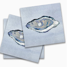 Blue cocktail napkins with hand-painted oyster illustration in soft coastal tones.