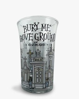 Shot glass with illustrated New Orleans above-ground tombs and the phrase ‘Bury Me Above Ground in New Orleans.’