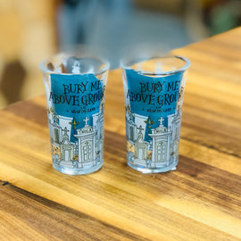 Shot glass with illustrated New Orleans above-ground tombs and the phrase ‘Bury Me Above Ground in New Orleans.’