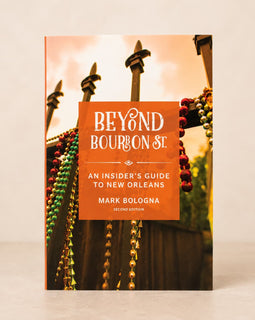 The book cover of 'Beyond Bourbon St.: An Insider's Guide to New Orleans' by Mark Bologna, shown standing upright against a light beige background.