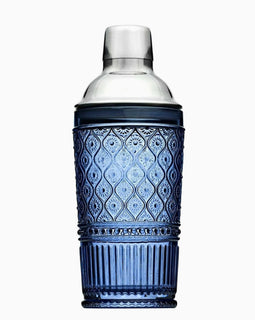 Blue patterned glass cocktail shaker with stainless steel top, 17 oz capacity, photographed on a white background.