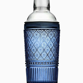 Blue patterned glass cocktail shaker with stainless steel top, 17 oz capacity, photographed on a white background.