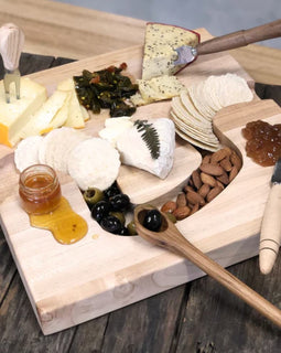 Handcrafted wood olive spoon with drip hole for serving olives”