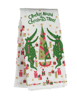 Holiday tea towel featuring dancing alligators around a Christmas tree with colorful gifts and stars.