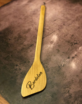 Flat-edged wooden roux spoon with hanging string and engraving