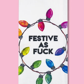 White tea towel with colorful retro Christmas lights and the phrase ‘Festive As Fuck’ in bold black lettering.