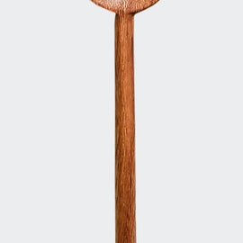 Hand-carved wooden cat stirring spoon with cat-shaped top and curved tail handle on a white background.