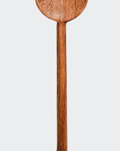 Hand-carved wooden cat stirring spoon with cat-shaped top and curved tail handle on a white background.