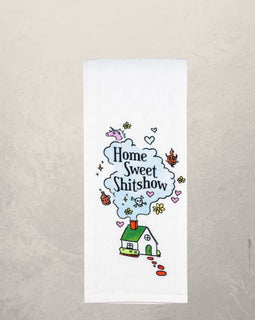 funny kitchen towel with “home sweet shitshow” phrase and whimsical house illustration