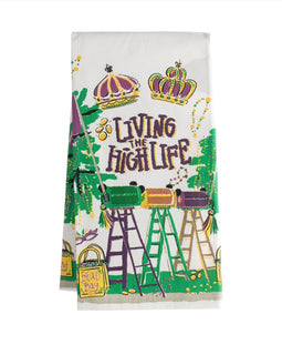Living the High Life Mardi Gras kitchen towel featuring colorful ladder throws, crowns, beads, and festive New Orleans-inspired artwork.
