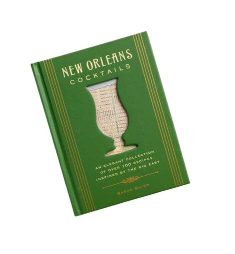 New Orleans Cocktails book by Sarah Baird – green hardcover with gold accents and a cutout Hurricane glass design on the cover.