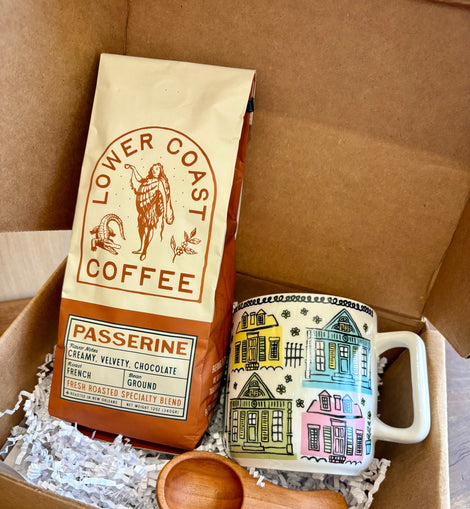 New Orleans Coffee Gift Box with Lower Coast Coffee “Passerine” French Roast, colorful New Orleans mug, and wooden coffee scoop.