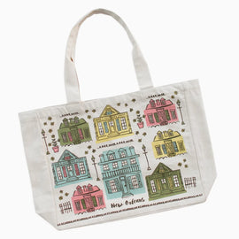 A white canvas tote bag featuring a colorful printed pattern of New Orleans houses and the words 'New Orleans' and 'La Vigne des Champs'.