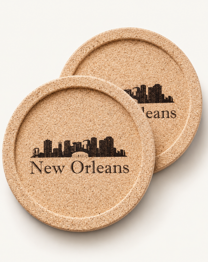 Two round cork coasters with a black New Orleans skyline and 'New Orleans' text, shown on a light beige background.