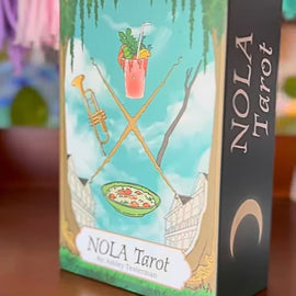 New Orleans–themed tarot cards including The Fool, King of Pentacles, and Two of Swords with colorful city-inspired illustrations.