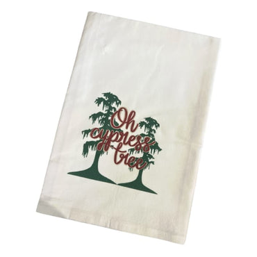 White tea towel with green cypress trees and red ‘Oh Cypress Tree’ holiday design.