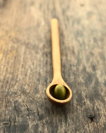 Handcrafted wood olive spoon with drip hole for serving olives