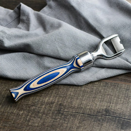 Corkscrew with blue and silver handle on a gray fabric background