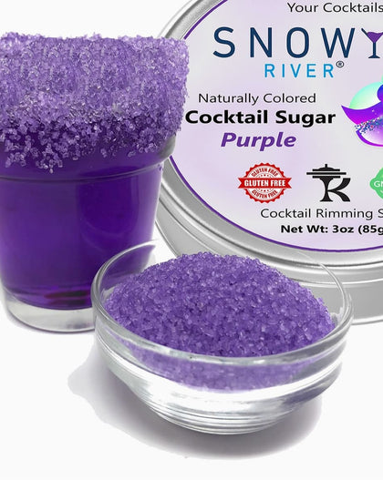 Purple cocktail rimming sugar in a tin with a purple-rimmed cocktail glass, all-natural sugar garnish for cocktails and margaritas.