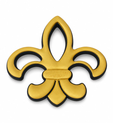 A gold fleur-de-lis metal emblem with a black backing shown on a plain white background.