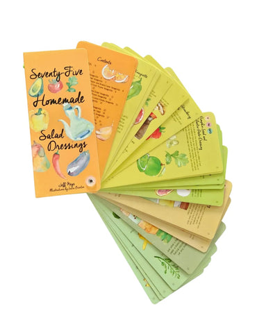 Fan-style flip book of ‘Seventy-Five Homemade Salad Dressings’ opened to show illustrated recipe cards.