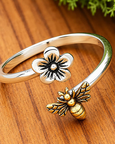 sterling silver adjustable ring featuring a cherry blossom flower and bronze honeybee