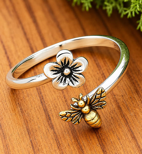 sterling silver adjustable ring featuring a cherry blossom flower and bronze honeybee