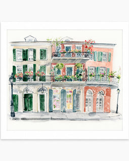 A watercolor art print depicting a row of classic French Quarter-style buildings with green shutters, balconies, and flower boxes, presented with a wide white border on a light gray background.