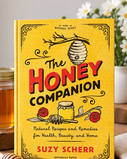 Cover of The Honey Companion by Suzy Scherr, a yellow vintage-inspired book featuring honey illustrations and natural recipes for health, beauty, and home.