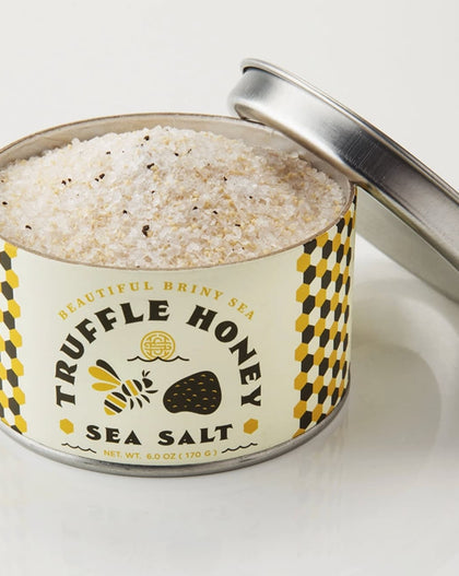 Tin of Beautiful Briny Sea Truffle Honey Sea Salt with visible coarse salt and truffle flecks.