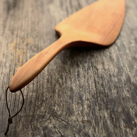 Handcrafted wooden pizza and pie server with hanging string