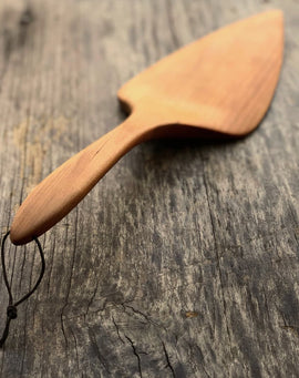 Handcrafted wooden pizza and pie server with hanging string