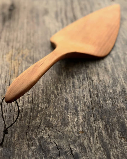 Handcrafted wooden pizza and pie server with hanging string