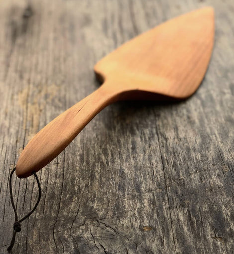 Handcrafted wooden pizza and pie server with hanging string