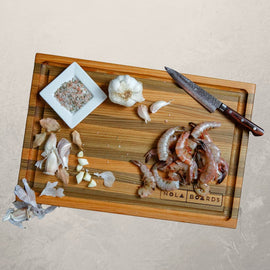 Atchafalaya Louisiana Sinker Cypress cutting board with juice groove, handcrafted in New Orleans with unique grain and dual-sided design