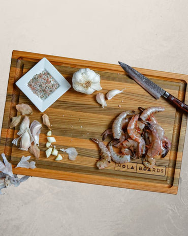 Atchafalaya Louisiana Sinker Cypress cutting board with juice groove, handcrafted in New Orleans with unique grain and dual-sided design