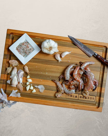 Atchafalaya Louisiana Sinker Cypress cutting board with juice groove, handcrafted in New Orleans with unique grain and dual-sided design