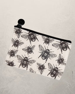 small zipper pouch with black bee print design on fabric