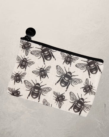 small zipper pouch with black bee print design on fabric