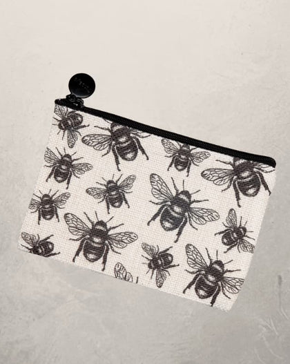small zipper pouch with black bee print design on fabric