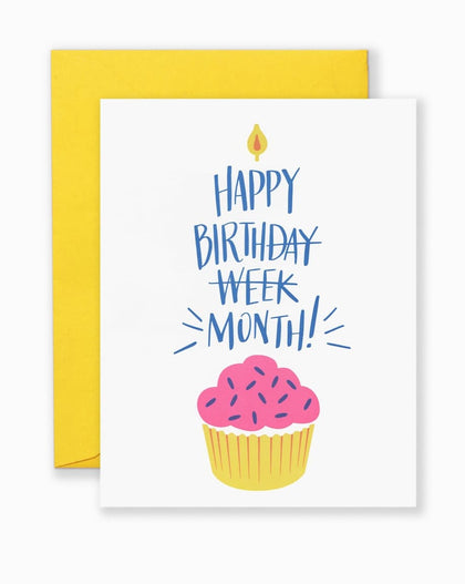 Greeting card with bold, playful typography reading “Happy Birthday Month” from Lionheart Prints, shown with kraft envelope
