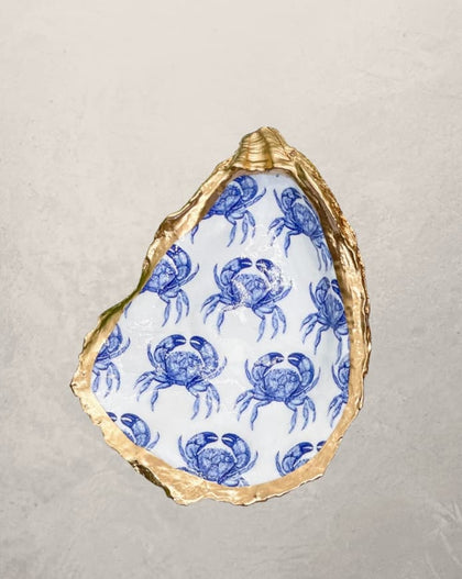 oyster shell trinket dish with blue crab pattern and gold edge
