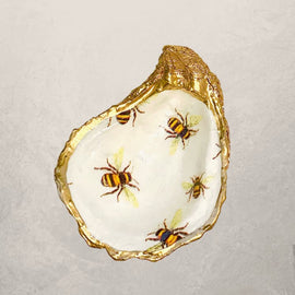 oyster shell trinket dish with bee design and gold edge