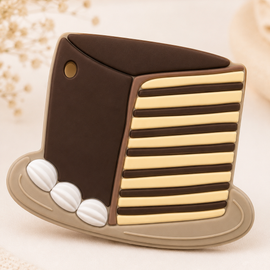 Decorative item resembling a top hat with striped design on a textured beige background