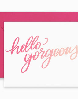 Greeting card with hand-lettered “Hello Gorgeous” design in stylish lettering, paired with kraft envelope