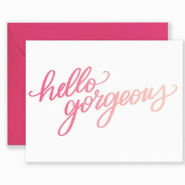 Greeting card with hand-lettered “Hello Gorgeous” design in stylish lettering, paired with kraft envelope
