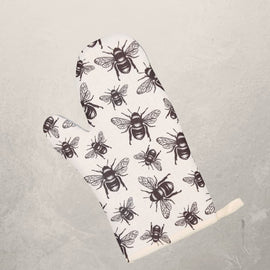 white oven mitt with black honey bee pattern